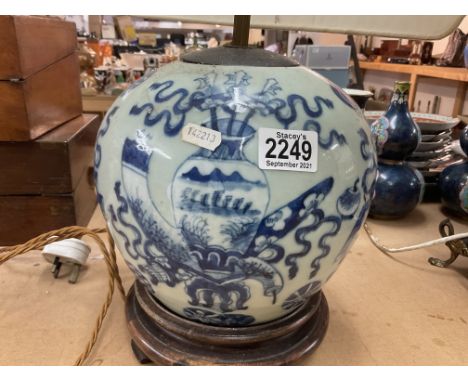 A Chinese celadon glaze jar converted to a table lamp.