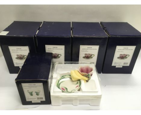 Five boxed Franz ceramic items comprising four Fritillary cups and saucers and one Kingfisher design salt and pepper set.