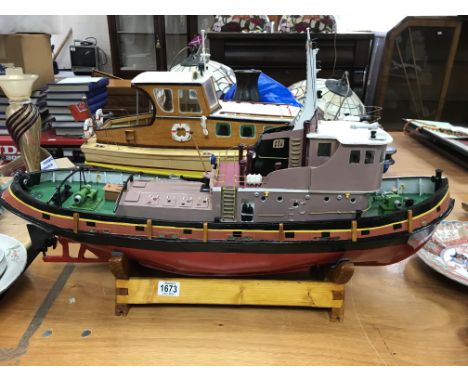 A wooden model of a tug boat, The Flying Dolphin. Fitted with an electric motor.