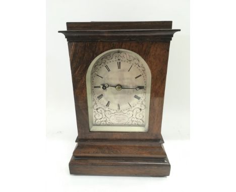 A four glass rosewood cased fusee mantle clock with key and pendulum.