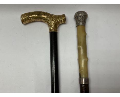 A gilt metal mounted walking stick plus a silver and horn topped walking cane - NO RESERVE