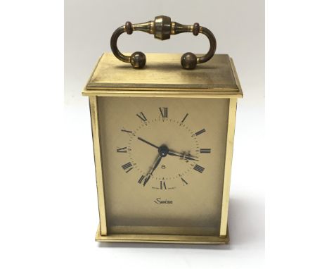 A brass cased carriage clock.