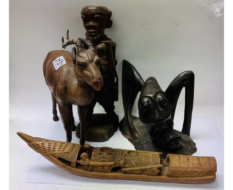 Group lot - a leather covered model of a Impala, Carved African fisherman figure, A carved Picasso style African figure, a ca