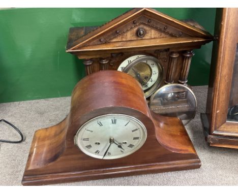 A man hog any mantle clock together with a 4 pillar oak mantle clock.