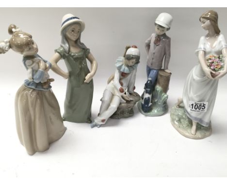 A collection of five figures including Nao and Lladro. One is a/f.