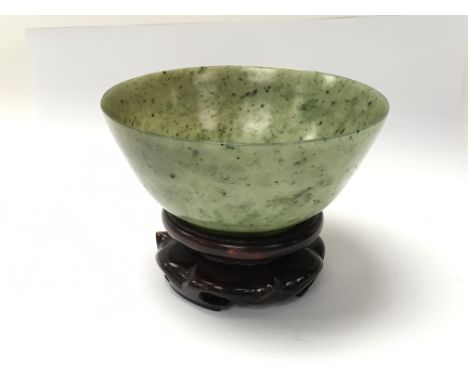 A jade bowl on a wooden stand - NO RESERVE
