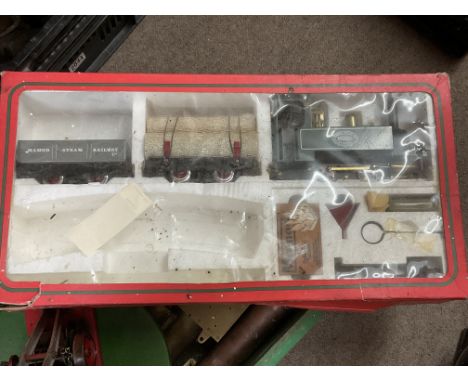 A boxed Mamod steam train and accessories together with a hand built working crane model and a large box of brass parts for w