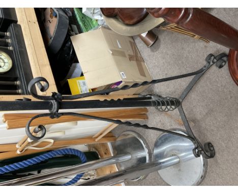 A wrought iron and brass adjustable height oil lamp stand.