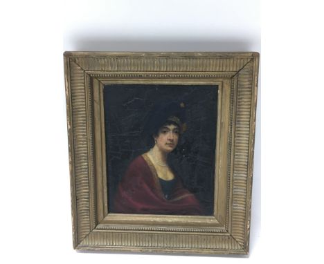 A framed small portrait on panel of a 19th century lady.