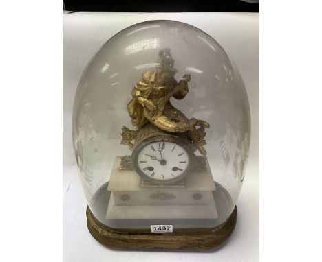 A French gilt and alabaster mantle clock under a dome.
