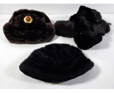 Three distinctive faux fur hats from Martin's collection to inc: one by 'Barbara Angelkon', two Russian made ushankas, one mo