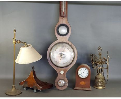 A 19th Century wheel barometer together with an Edwardian mantle clock, a clock bracket, an adjustable brass table lamp and a
