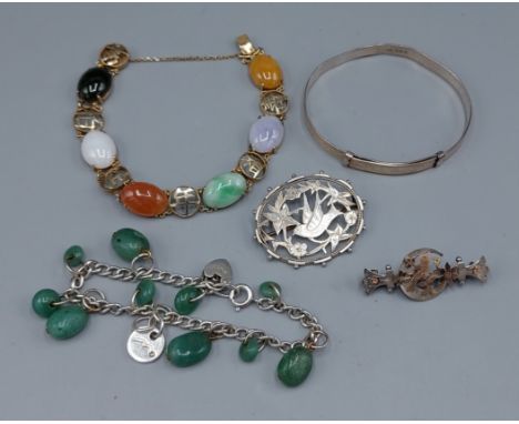 A Chinese silver gilt stone set bracelet together with a stone set bracelet, a bangle and two silver brooches