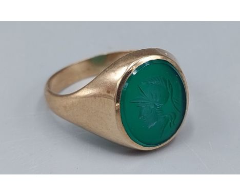 A 9ct gold Signet ring, the green stone with Intaglio in the form of a classical bust, 6.6gms, ring size V