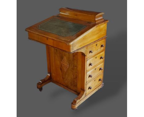 A 19th Century marquetry inlaid Davenport with a hinged writing surface above four side drawers opposed by dummy drawers 