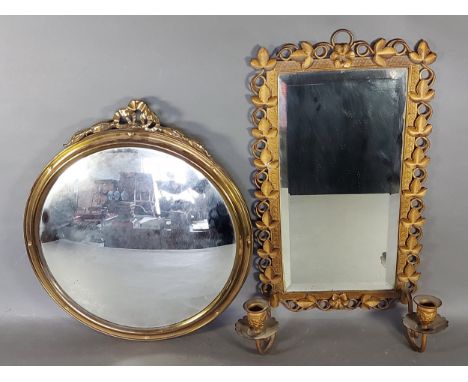 A golded metal Girandole of leaf form, 46cms x 25cms together with a circular wall mirror