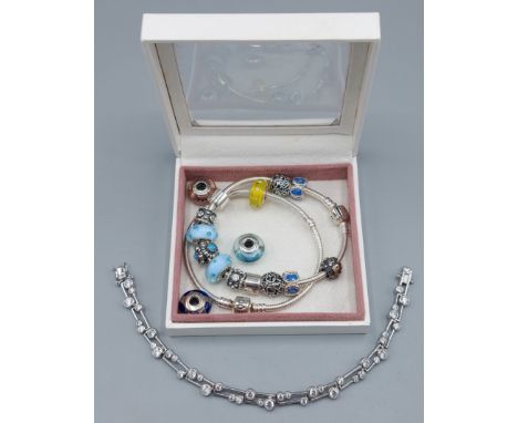 Two Pandora Charm bracelets together with a silver stone set bracelet 