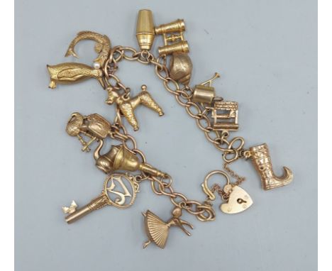 A 9ct gold Charm bracelet with padlock clasp and many Charms, 31gms