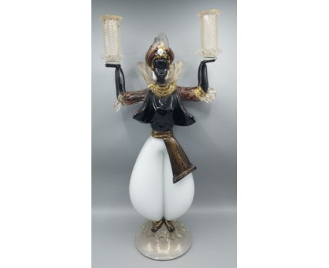 A Murano glass twin branch candlestick of figural form, 49cms tall