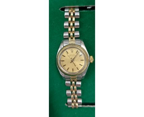 A Rolex Oyster Perpetual stainless steel and gold ladies wristwatch with Champagne dial, serial number 962464 with original b