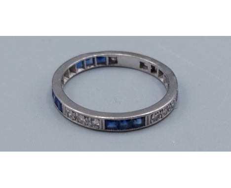 A white gold full eternity ring set Sapphires interspersed with Diamonds, ring size T, 3.9gms
