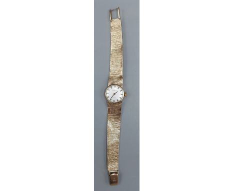 A 9ct Gold Ladies wristwatch by Tissot with 9ct Gold strap, 21.2gms excluding movement