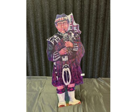 A stick stand in the form of a Scottish bagpipe player. [93cm in height] 