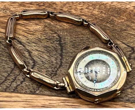 A Ladies vintage 9ct yellow gold strap watch. Tavannes watch Co, 15 Jewels, Mother of pearl numeral dial. [21.69grams] [Non- 