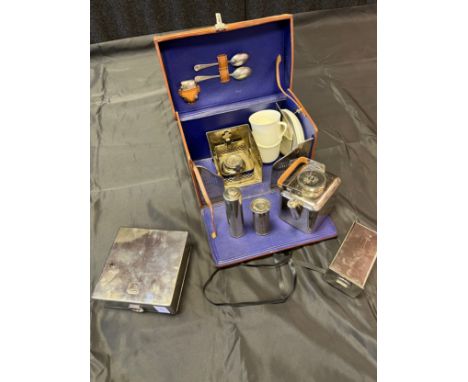 A Vintage leather bound portable tea maker set. Includes vesta case, spirit kettle, filters and cups produced by G.W.G &amp; 