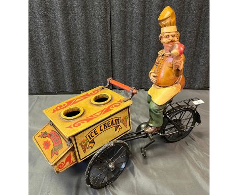 A Vintage ice cream cart and vender on bike figure.  [50x56cm] 