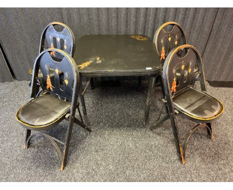 A Vintage folding garden table and four matching folding chairs detailed in an oriental manner. Produced by Louis Rastetter &
