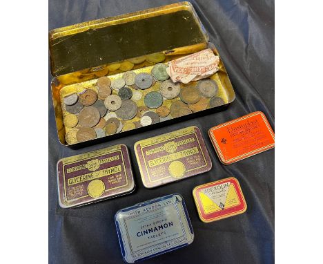 A Selection of vintage advertising tins together with a mixed quantity of world coins which includes some silver. 