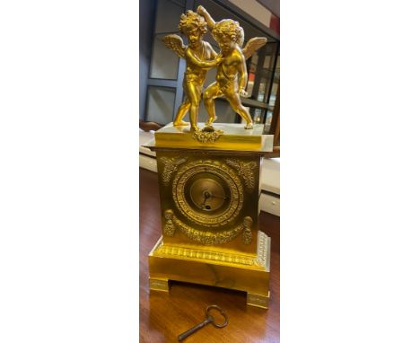 A 19th century gilt brass ormolu mantle clock produced by Villemsens- A. Paris. Fitted with two cherubs figures play fighting