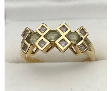 A Ladies 9ct yellow gold ring set with clear stones. [Ring size O] [2.73Grams]