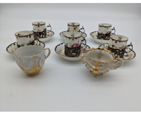 Set of six porcelain cups and saucers in a floral design, within marked London silver holders [Cauldon] together with two oth