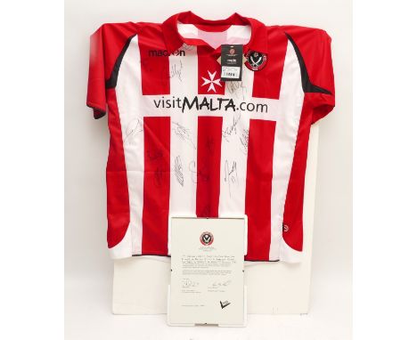 A Sheffield United shirt, autographed by the 2009/2010 team, complete with Letter of Authenticity confirming the legitimacy o