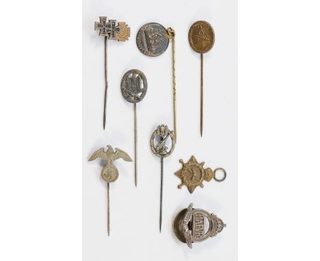 A WWI German miniature iron cross stickpin, four WWII German stickpins, a AAFVR button hole, numbered 17722, a 1914-15 miniat