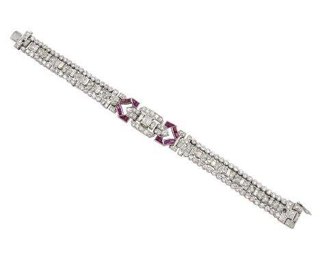 Art Deco platinum diamond and ruby bracelet, circa 1920-1930, the central panel set with a single emerald cut diamond of appr