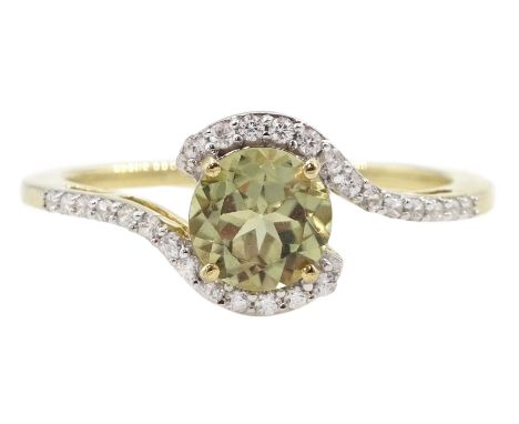 9ct gold csarite and white zircon crossover ring, hallmarked Condition Report:Approx 2.2gm, size R-S, well presented ring in 