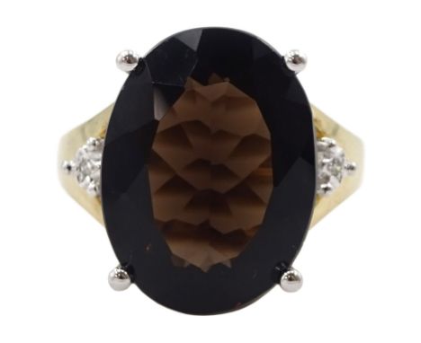 9ct gold oval smokey quartz ring, with diamond set shoulders, hallmarkedCondition Report:Approx 4.3gm, size K, ring depth = 1
