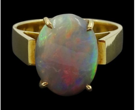 18ct gold single stone oval opal ring, stampedCondition Report:Approx 7.05gm, size O, band depth = 4.5mm, opal = 13mm x 10mm