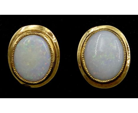 Pair of 9ct gold single stone oval opal stud earrings Condition Report:Approx 3.4gm, head = 13mm x width 11mm, tested 9ct