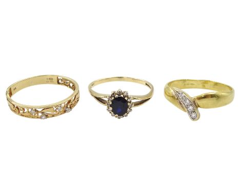 Gold diamond set openwork ring and a gold sapphire and diamond cluster ring, both hallmarked 9ct and an 18ct gold four stone 