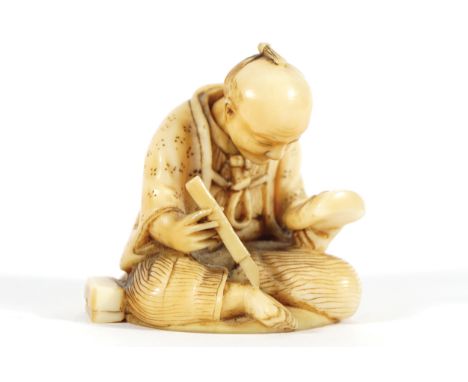 ANTIQUE NETSUKE of an artisan carving Kabuki theatre mask