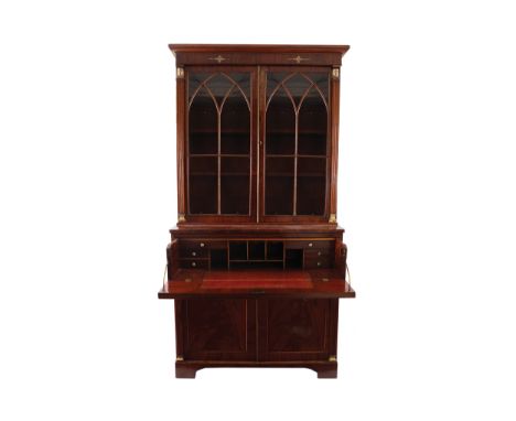 REGENCY PERIOD MAHOGANY SECRETAIRE SPHINX DECORATED BOOKCASEthe superstructure with a moulded crown, above two Gothic arched 