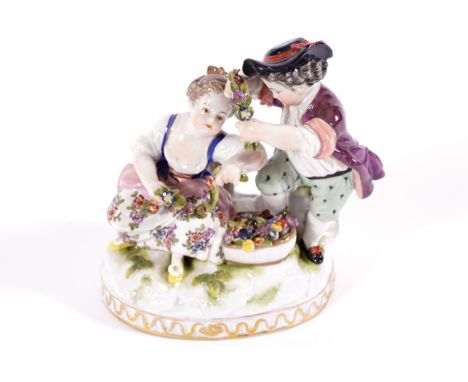 NINETEENTH-CENTURY CAPODIMONTE PORCELAIN GROUP of two children playing with flowers 13 cm. high
