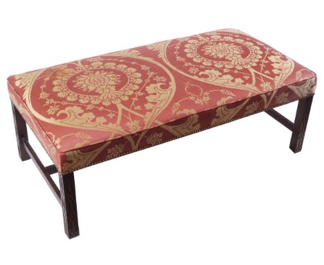 LARGE CHIPPENDALE STYLE BLIND FRETWORK CARVED AND UPHOLSTERED STOOL the rectangular upholstered stuff-over seat, raised on bl