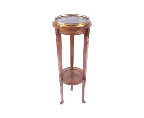 NAPOLEON III ORMOLU MOUNTED MAHOGANY TWO TIER TORCHEREthe circular marble inset top, below a pierced brass gallery rail, abov