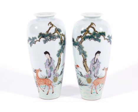 PAIR OF CHINESE QING PERIOD FAMILLE ROSE VASESeach depicting a young woman and a deer in a landscape.   Seal mark to base 18 