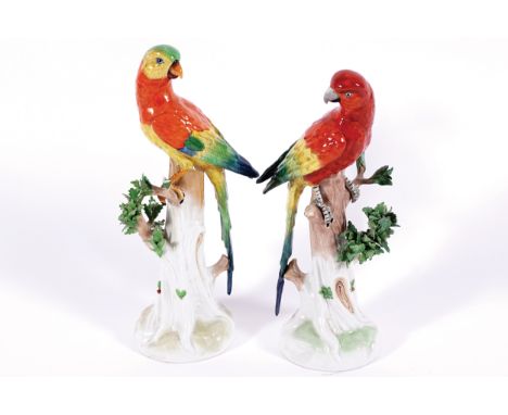 PAIR OF DRESDEN PORCELAIN POLYCHROME PARAKEETS each perched on a tree trunk 31 cm. high (2)